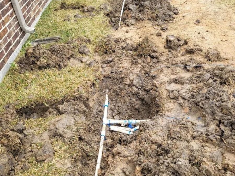 Excavated sprinkler line during a leak repair